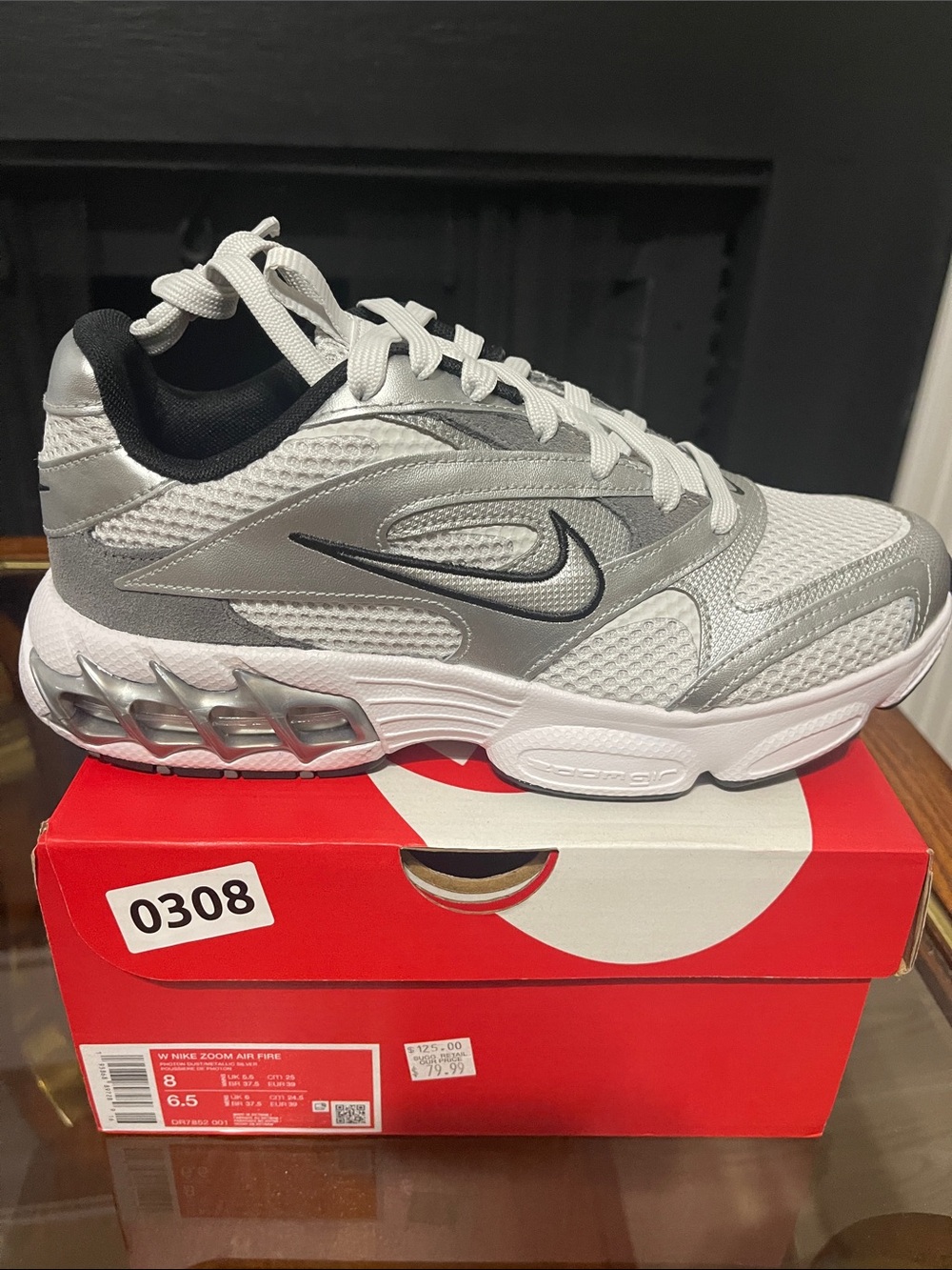 Nike women’s Silver/Black Mesh Running Sneakers